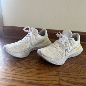 White and Yellow Athletic Shoes